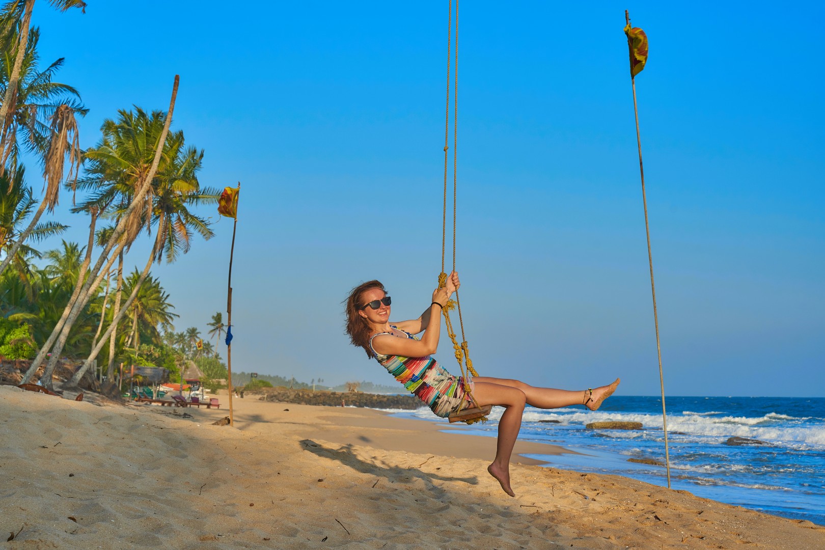 Young,Girl,On,A,Swing,On,A,Paradise,Beach